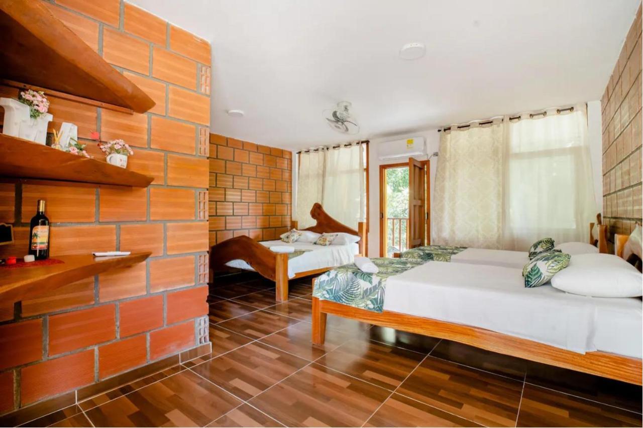 Arca Tayrona Restaurant & Hostal Los Naranjos Bagian luar foto